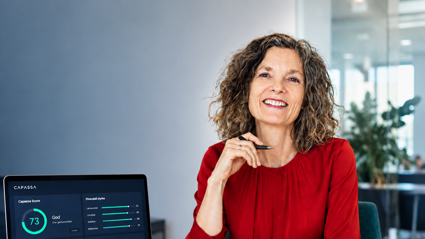 Marit Wetterhus at her desk, with Capassa Score open on the laptop in front of her
