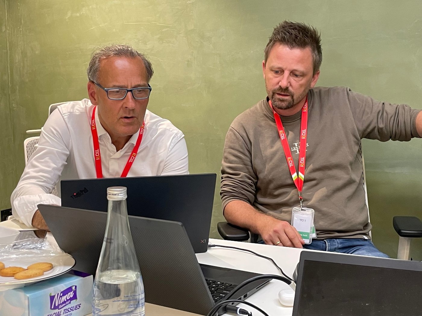 A leader and a colleague looking at the numbers together